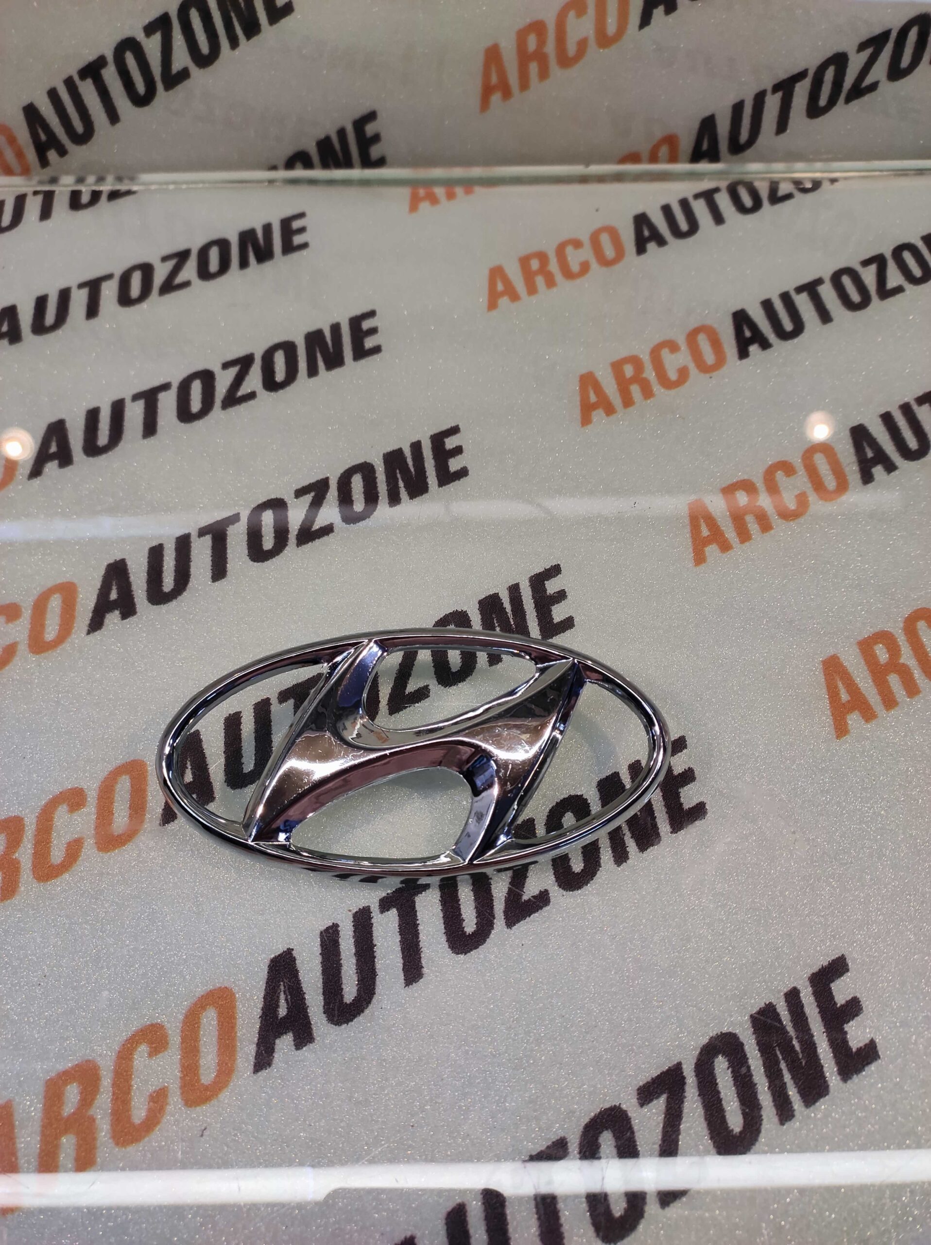 FRONT GRILL LOGO I10 IST GEN IND